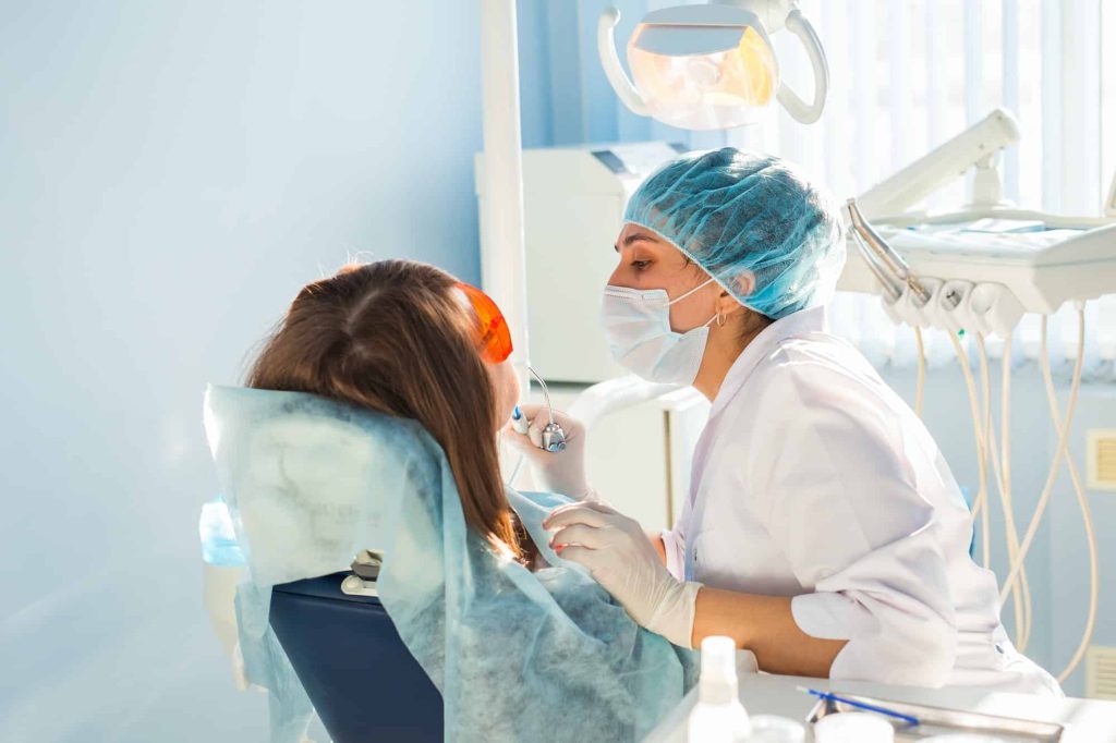 A patient receiving dental treatment at a dental clinic